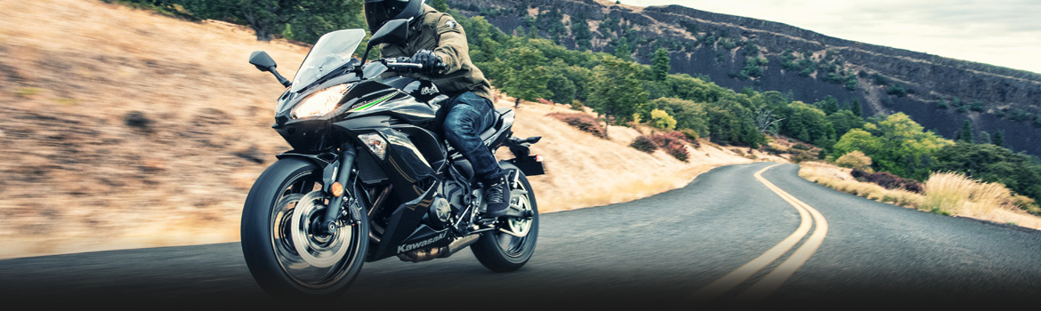 2017 Kawasaki Ninja® 659 in a highway | Service Department Banner